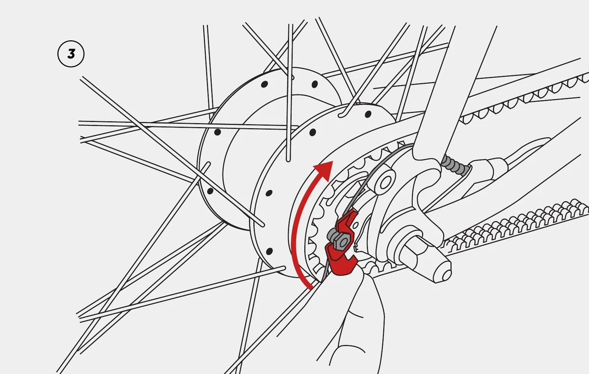 Loosening the Shimano Alfine shift cable at the rear hub cassette joint.