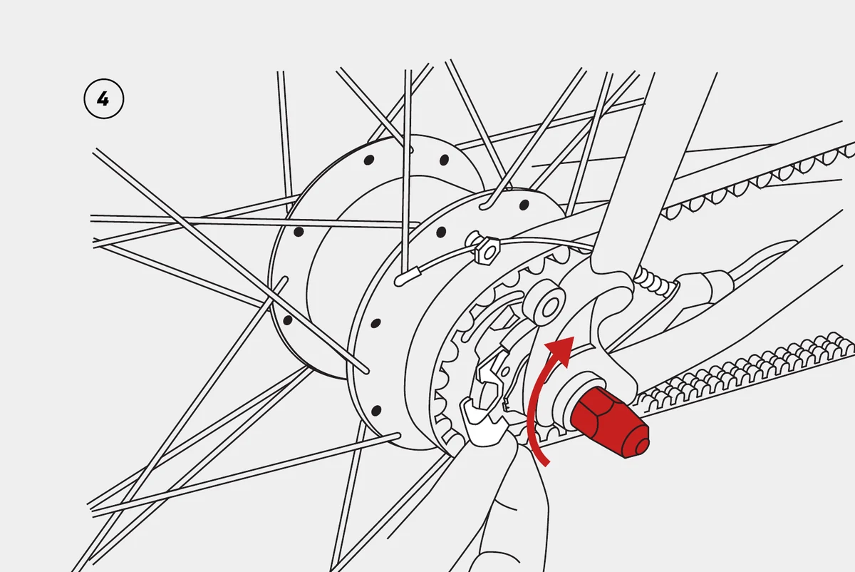 Loosening the rear axle nuts on a Shimano Alfine rear hub.