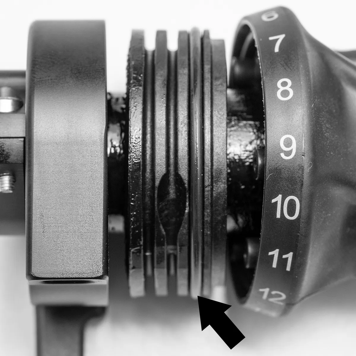 The O-ring on the cable drum of the twist shifter, next to the two cable guide grooves.