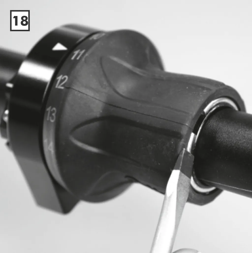 Refitting the circlip on the twist shifter after fitting the new grip rubber.